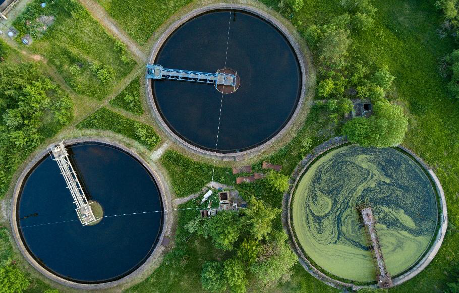 Aerial view of circular sewage treatment clarifier tanks